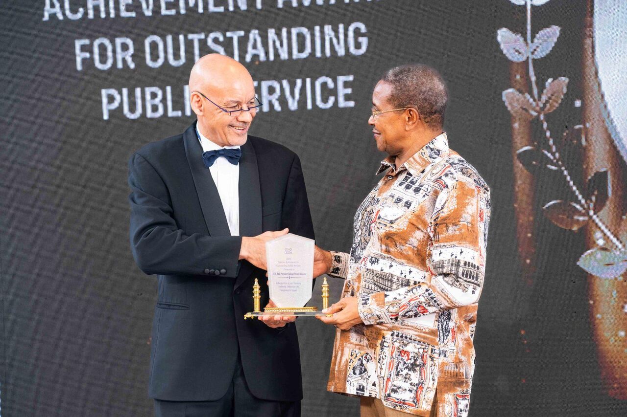 An award for outstanding public service being presented on stage